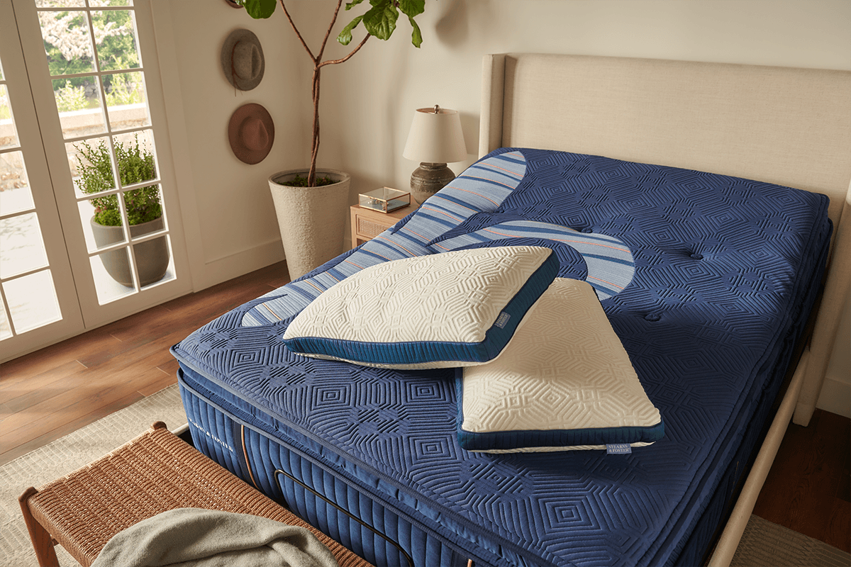 Two Lux Estate Pillows on a Mattress