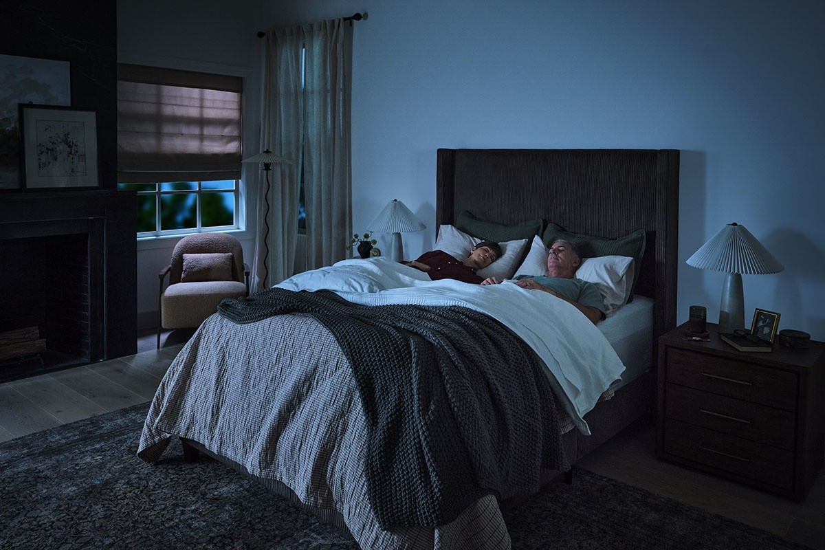 A couple sleeping in their bedroom