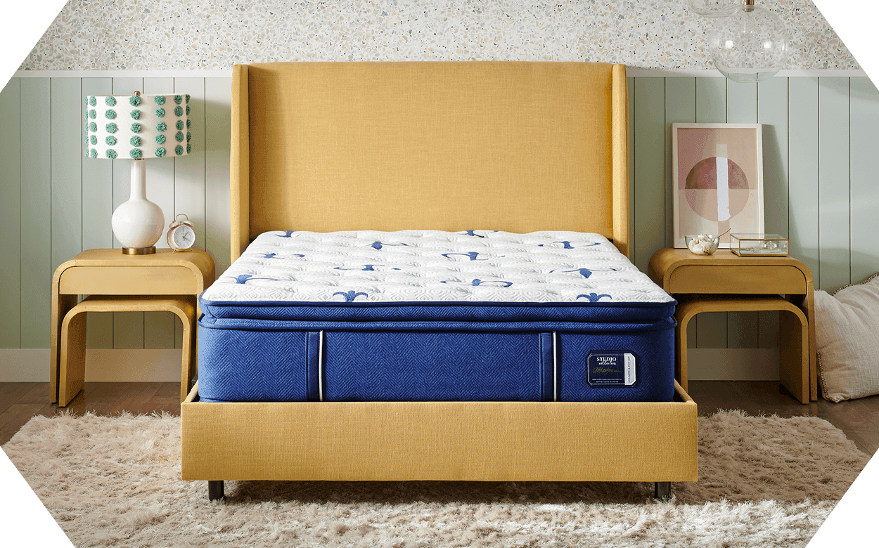 bare hexogon shaped image of a styled room with a Studio Stearns and Foster mattress