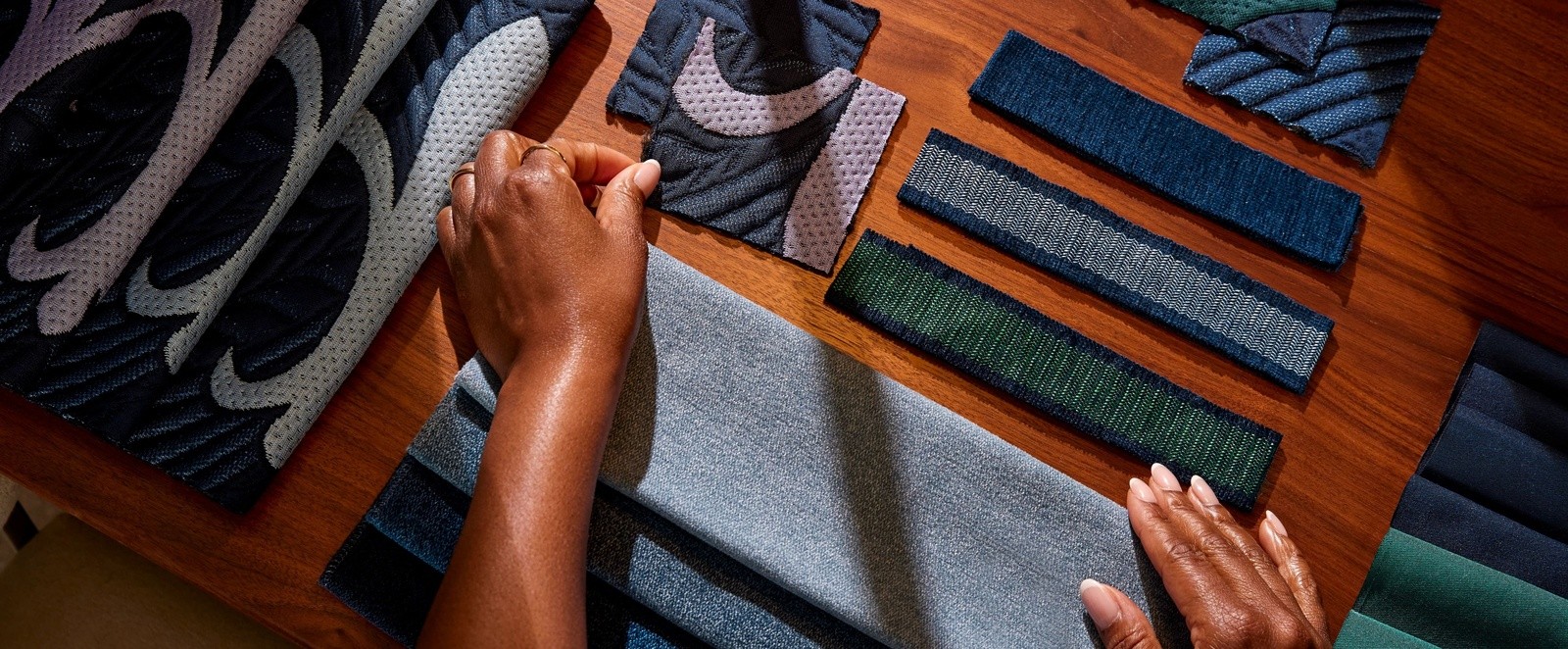 Master craftsman hands over fabric