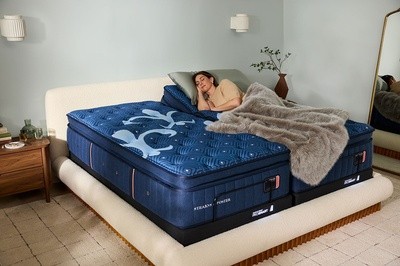 A woman napping on a LuxEstate mattress